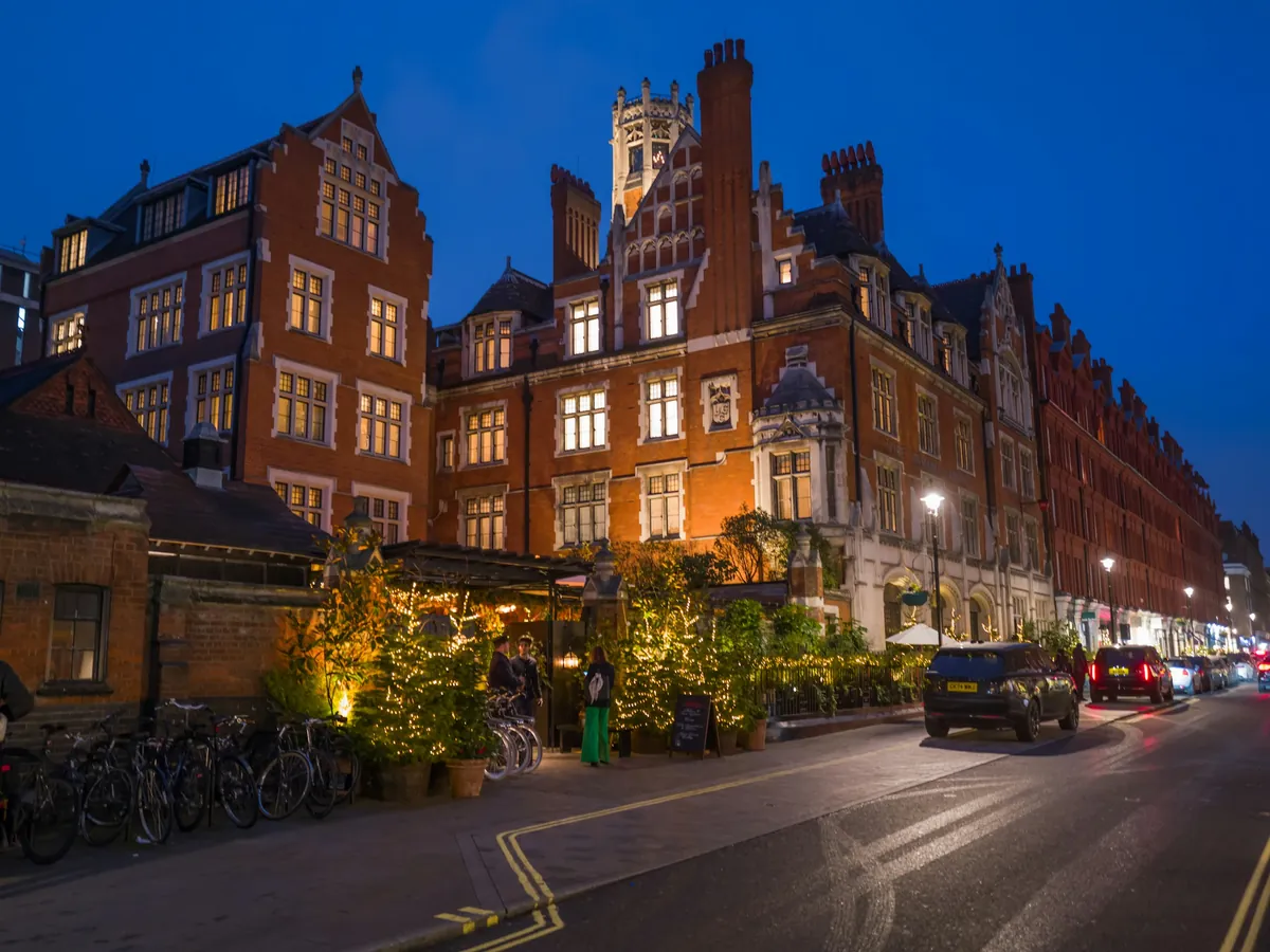 A hotel exterior lit at dusk