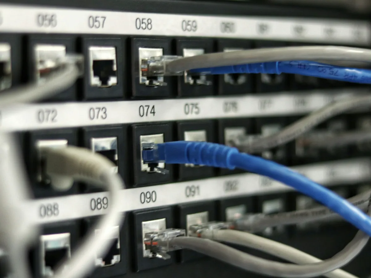 A labelled patch panel in a comms room