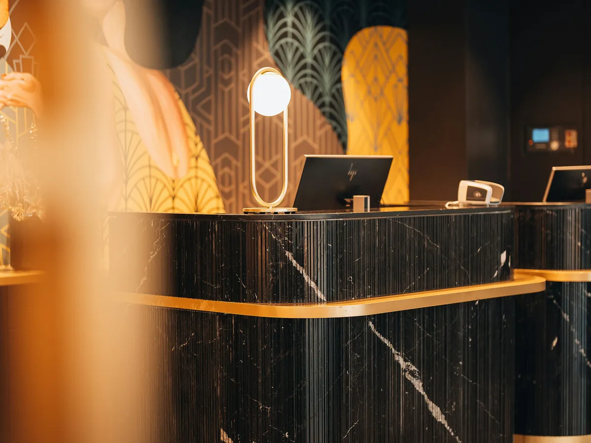 A hotel reception desk in the evening